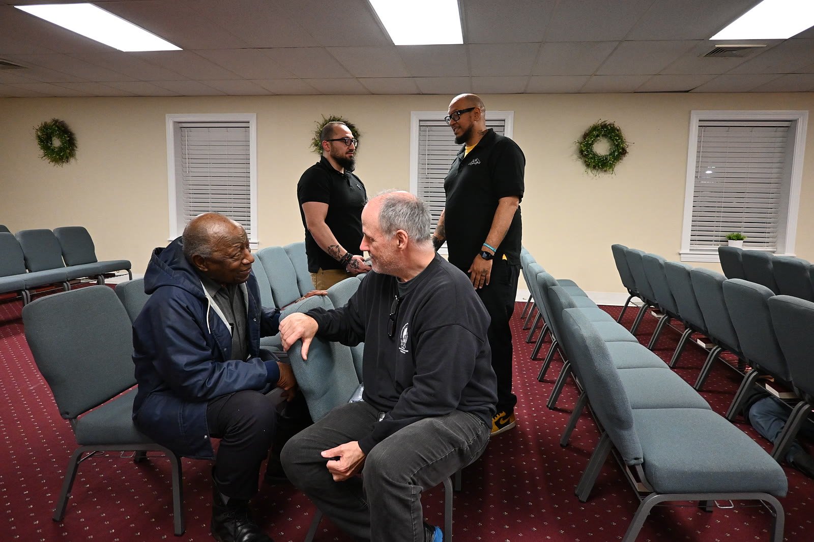 Adults studying the Bible together